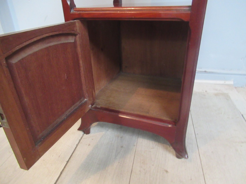 A tall reddish-brown mahogany side cabinet features a veined marble top, an upper drawer, an open central shelf, and a lower single door cupboard. View VIII