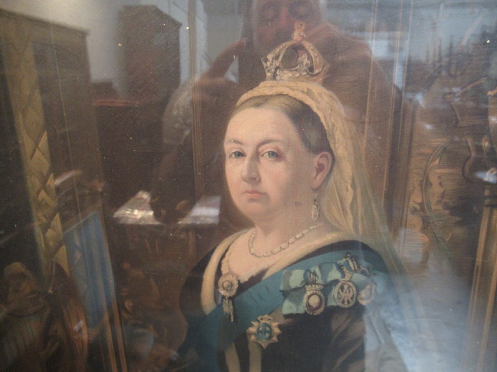 A full-length portrait of Queen Victoria in ceremonial attire, presented within a rectangular moulded gilt frame. View V
