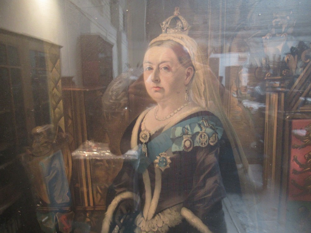 A full-length portrait of Queen Victoria in ceremonial attire, presented within a rectangular moulded gilt frame. View VI