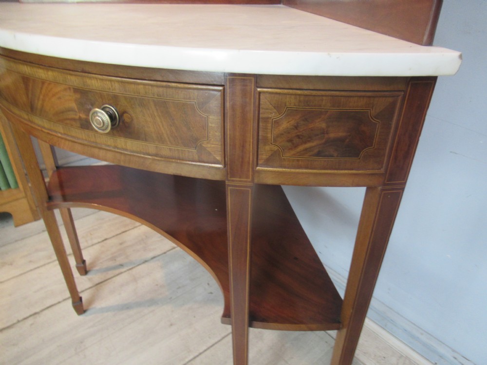 Edwardian mahogany   corner wash stand   with a marble   top. View X