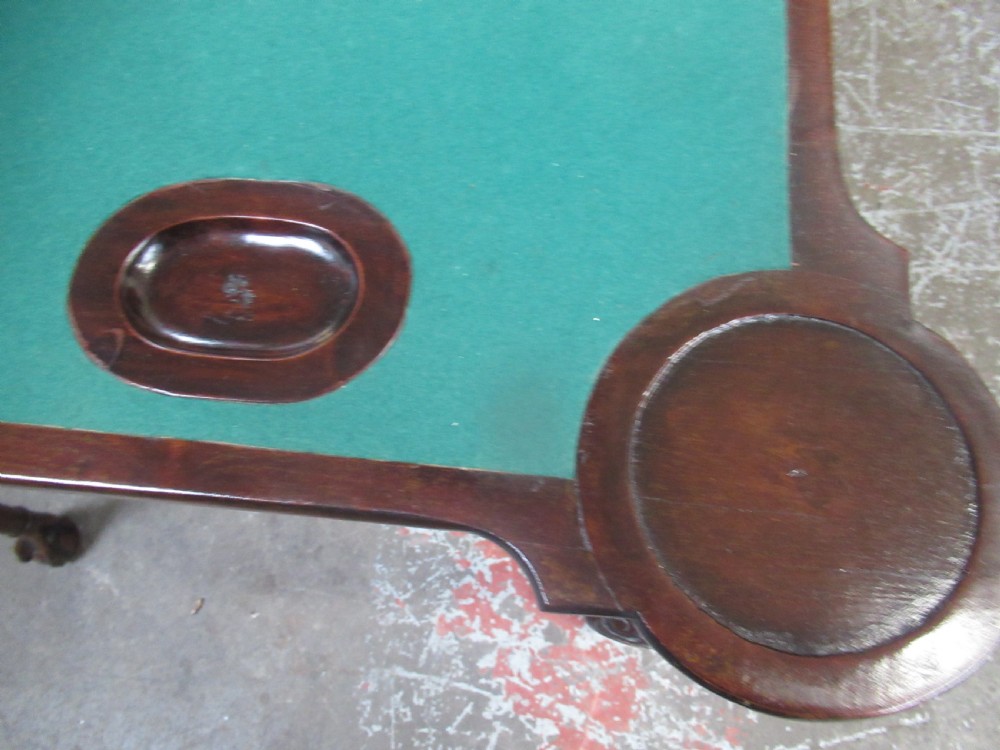 A Georgian mahogany fold-over card table featuring carved cabriole legs with acanthus knees and claw and ball feet. View XII