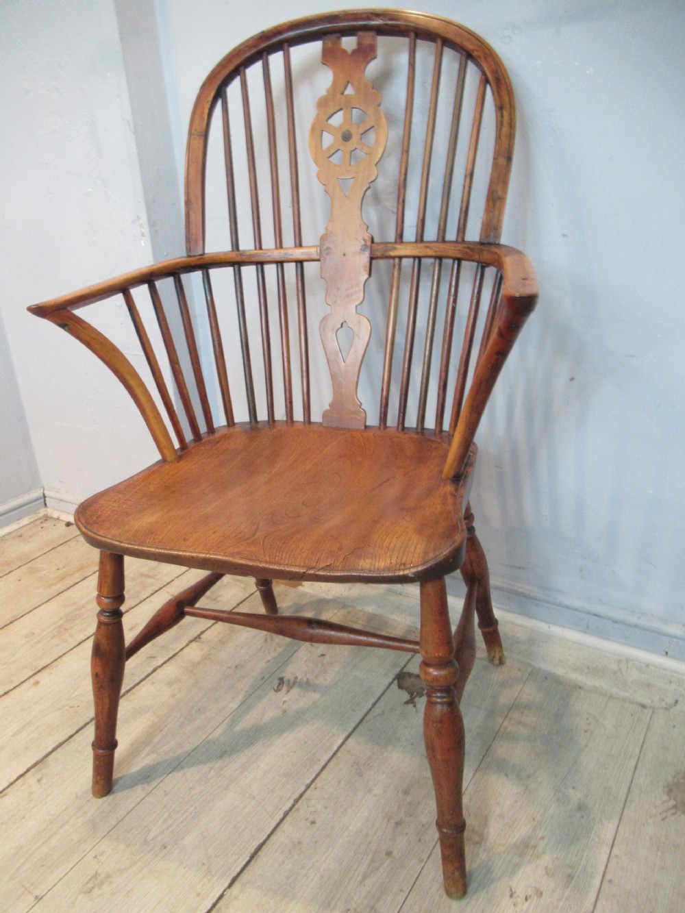 A 19th century   Yew wood Windsor arm chair 