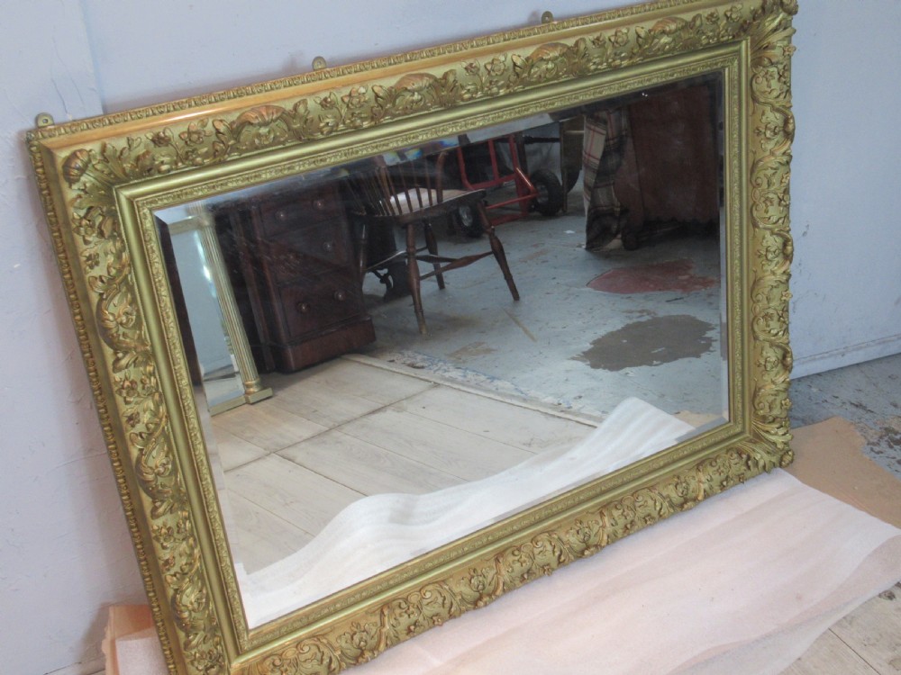 A large 1900s    deep gilt framed wall mirror  View II