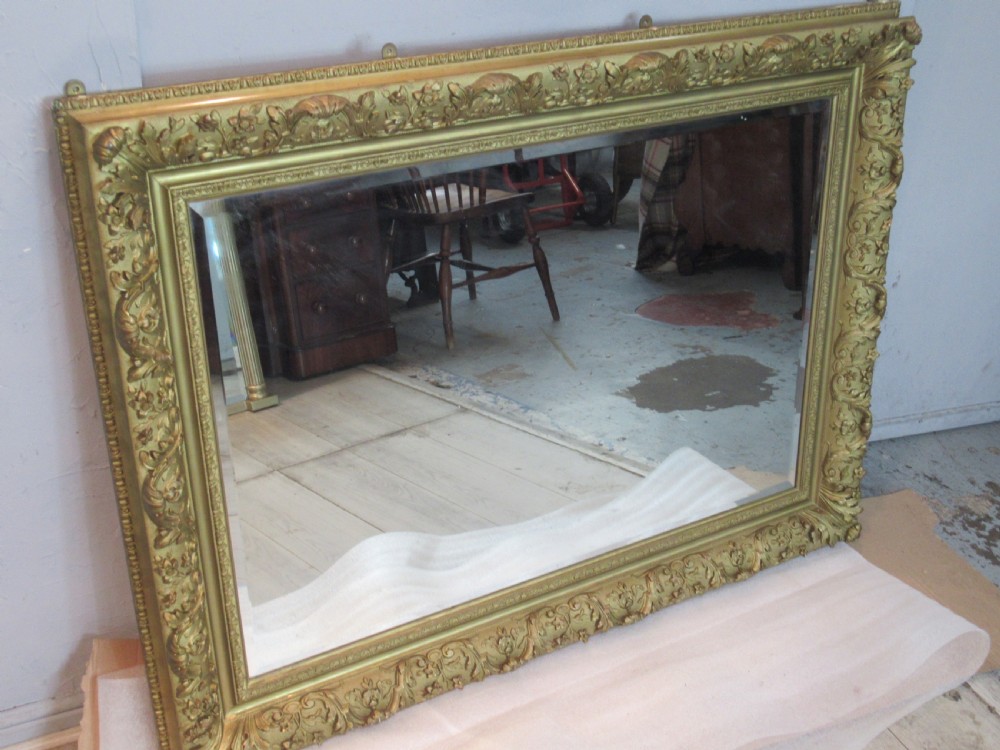 A large 1900s    deep gilt framed wall mirror  View X