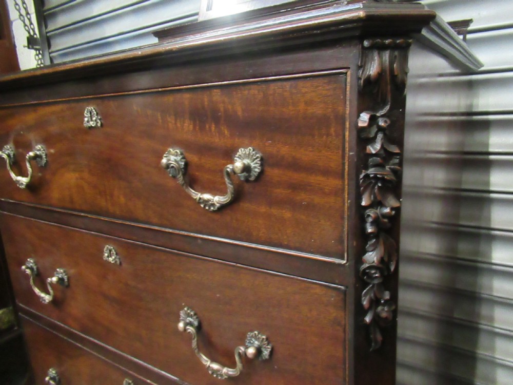 A dark mahogany Chippendale style dressing chest featuring four graduated drawers, brass handles, bracket feet, and a central arch-topped swing mirror. View XIII