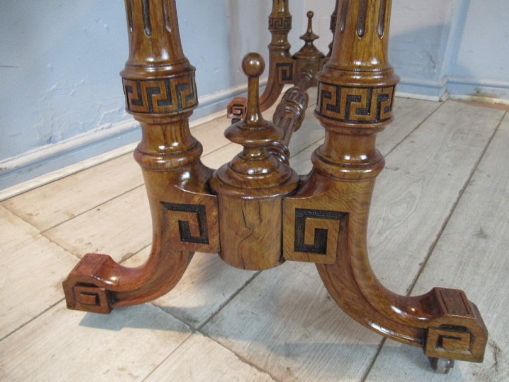 A Victorian burr oak side table featuring a polished rectangular top with rounded corners, supported by twin turned columns and a central finial stretcher. View VIII