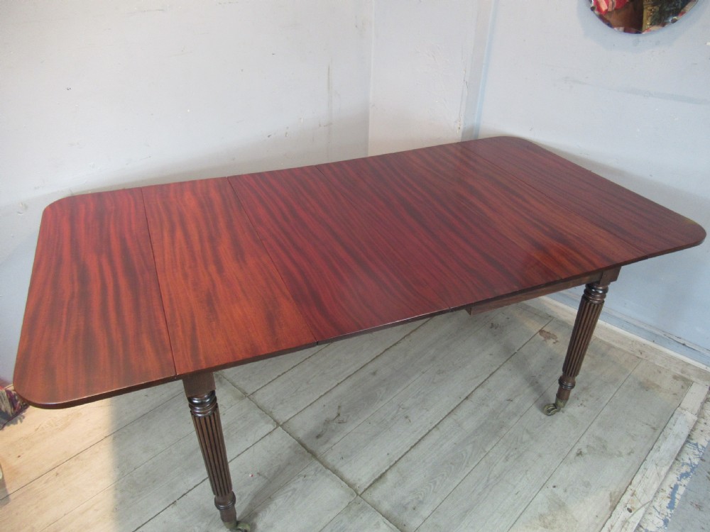 Regency drop leaf extending mahogany dining table 