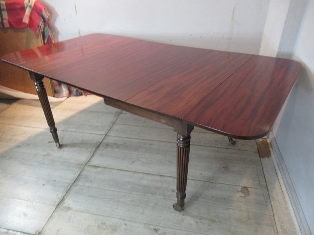 Regency drop leaf extending mahogany dining table  View II