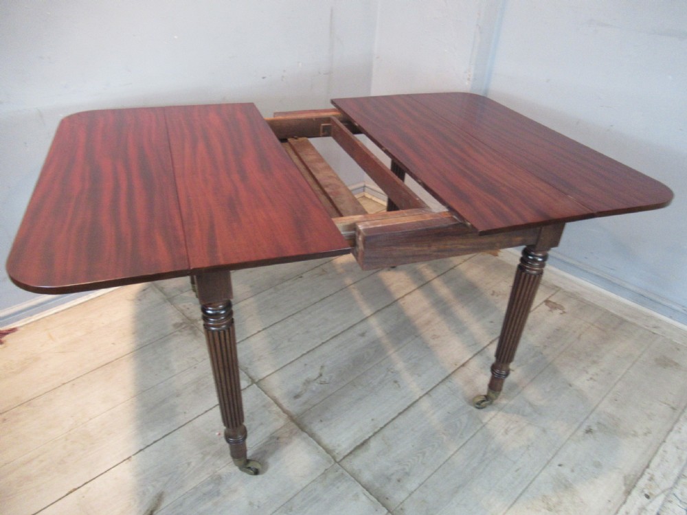 Regency drop leaf extending mahogany dining table  View VII