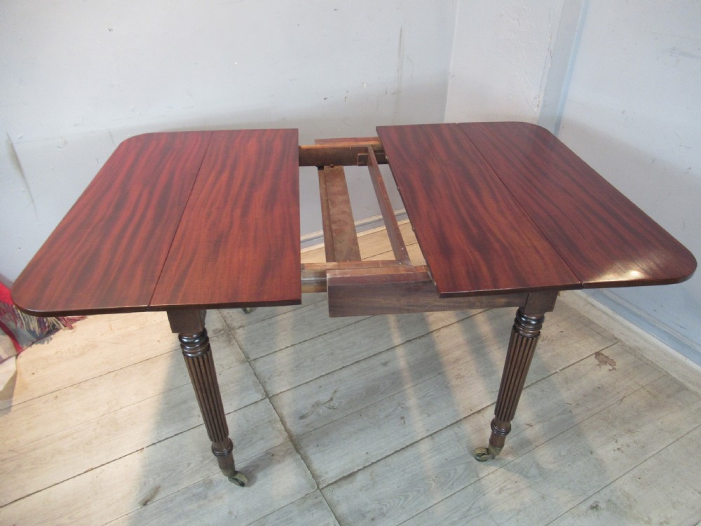 Regency drop leaf extending mahogany dining table  View VIII