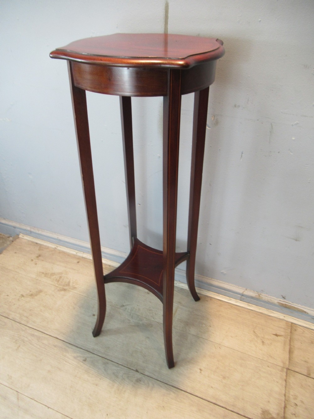 A mahogany   tall plant / figure stand