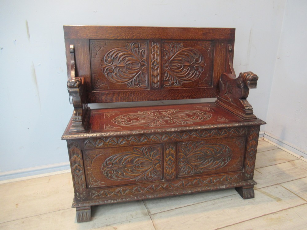 A carved oak monks bench seat   1920 View II