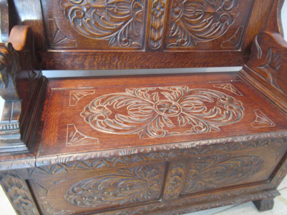 A carved oak monks bench seat   1920 View V