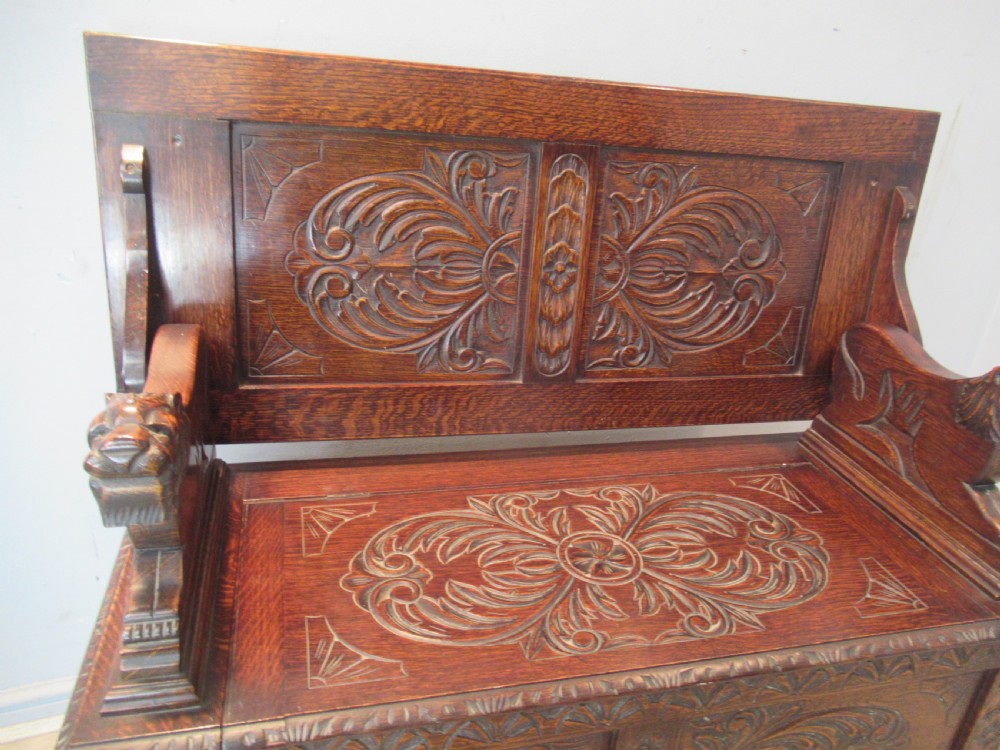 A carved oak monks bench seat   1920 View VI