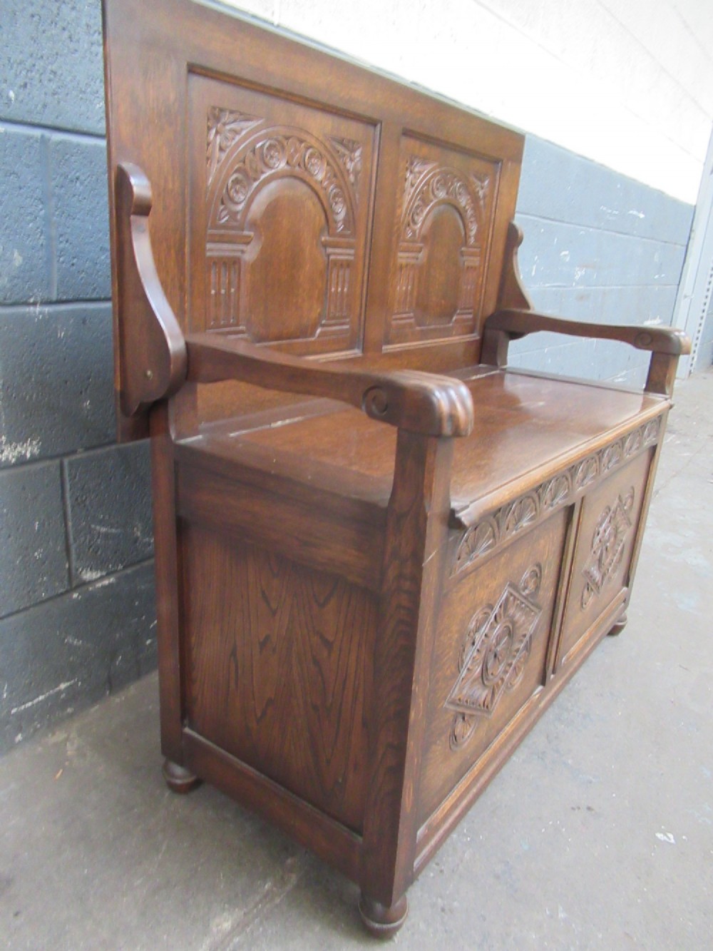 A 1920s  oak Monks bench seat View X