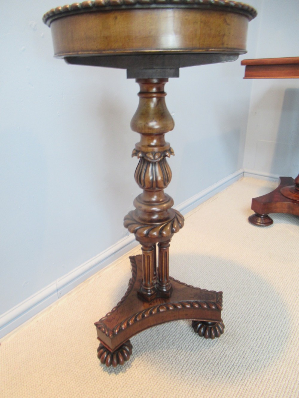 A 19th-century mahogany circular plant stand featuring a carved rope-twist rim, turned central column, and tripod base. View III