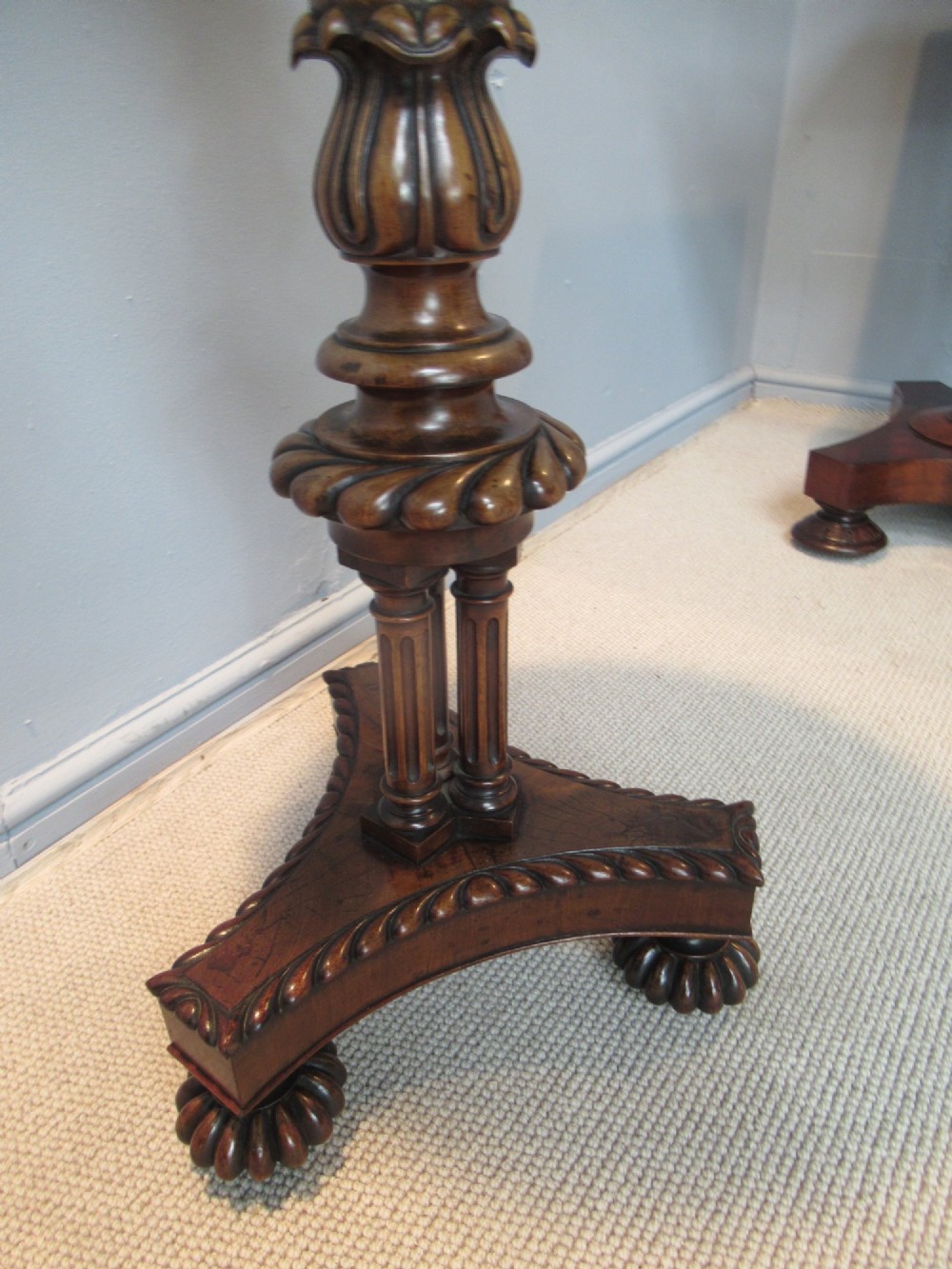 A 19th-century mahogany circular plant stand featuring a carved rope-twist rim, turned central column, and tripod base. View IV