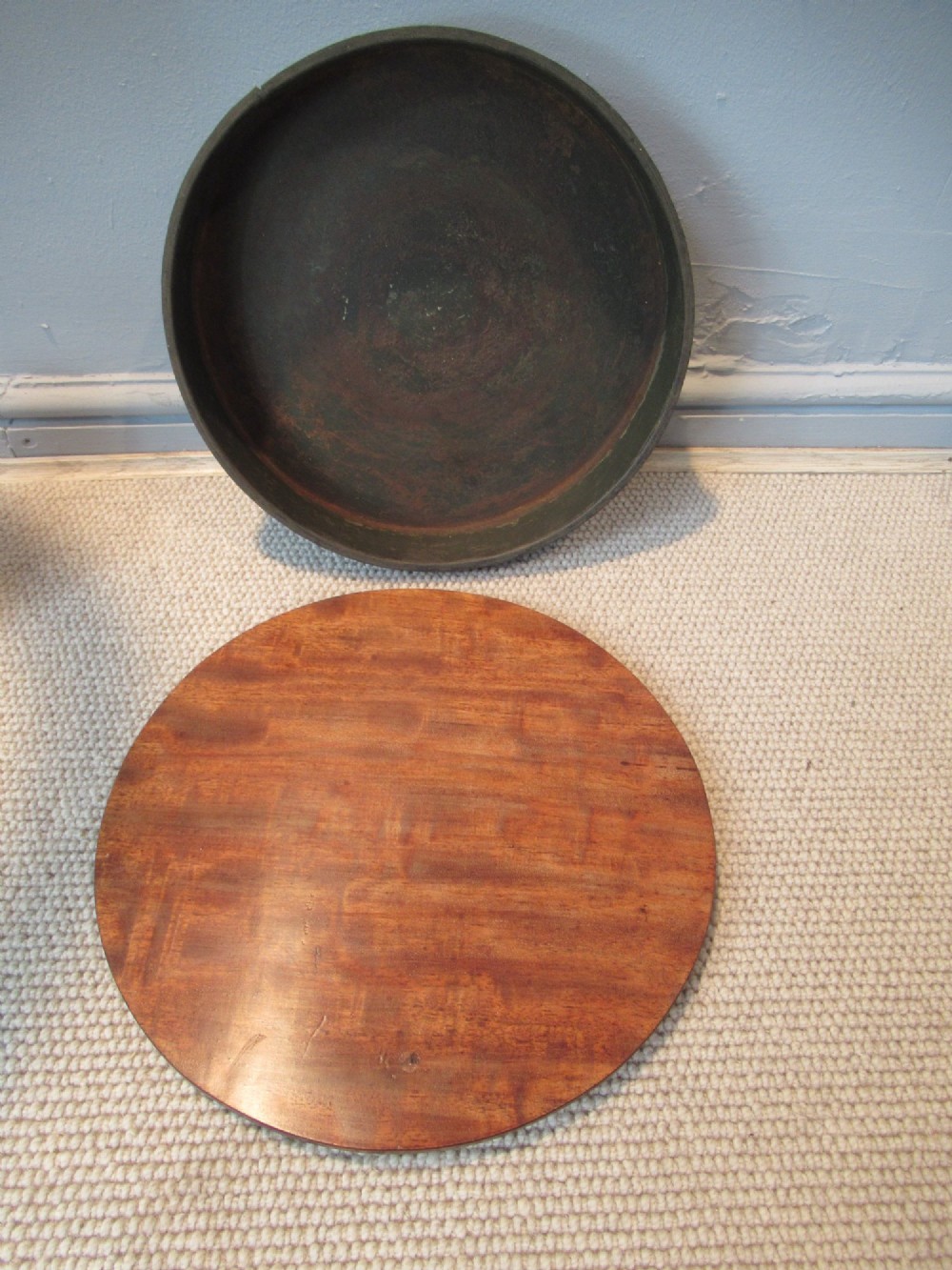 A 19th-century mahogany circular plant stand featuring a carved rope-twist rim, turned central column, and tripod base. View X