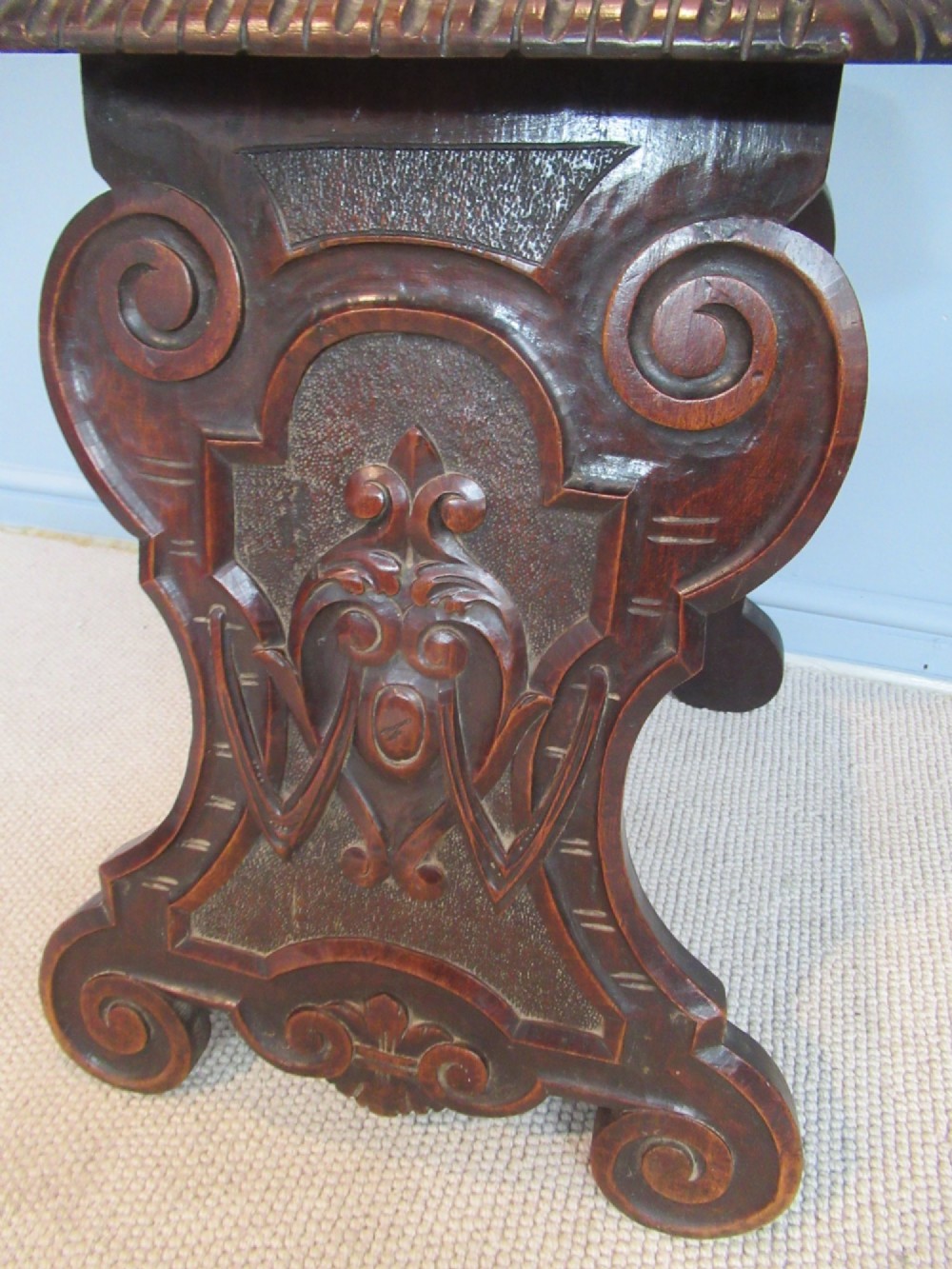 A Victorian carved mahogany hall chair featuring a detailed lion head mask sculpted into the backrest and a solid timber seat. View IX
