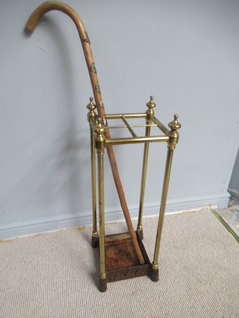A    brass and cast iron       1900s walking stick stand.