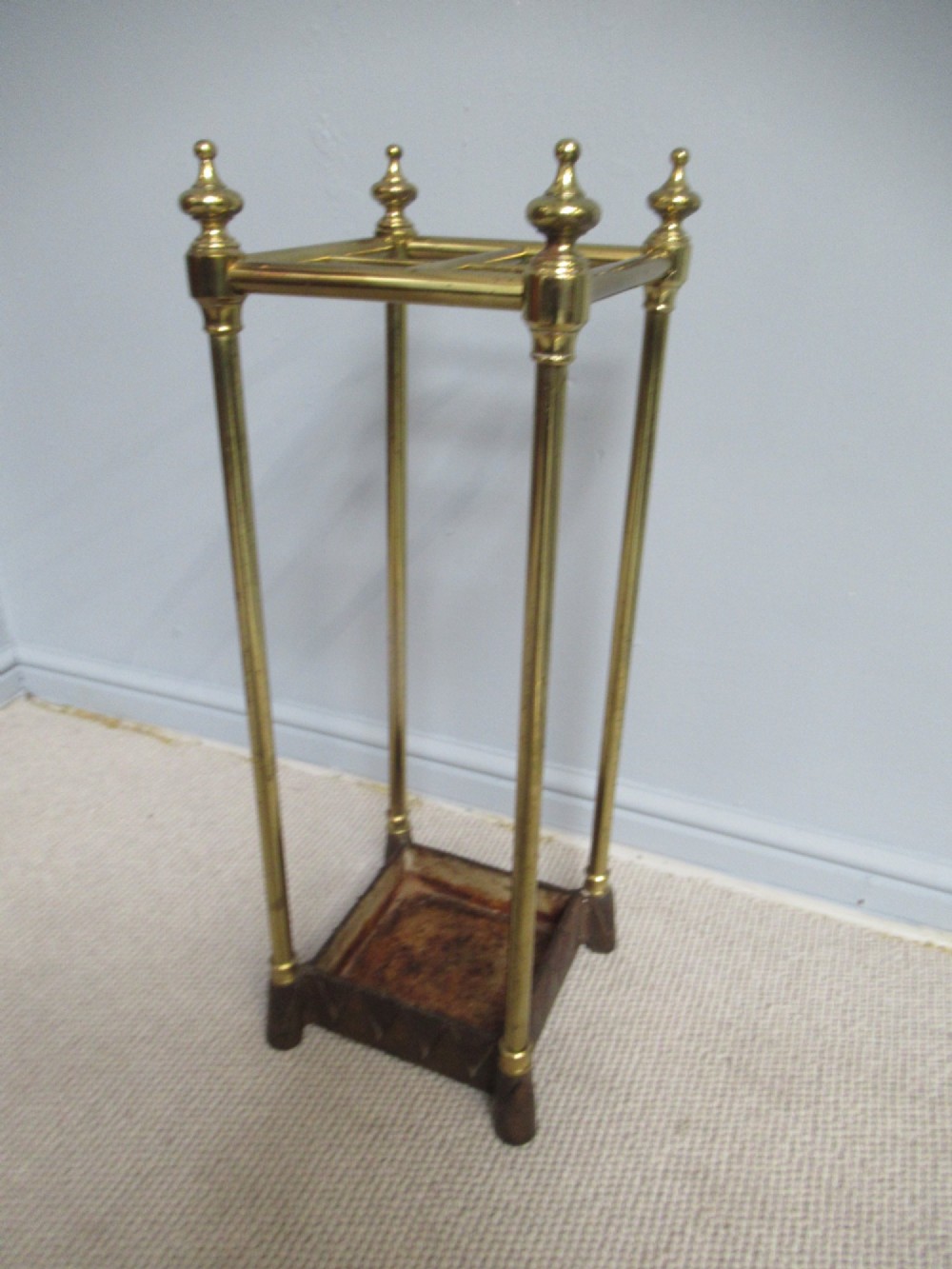 A    brass and cast iron       1900s walking stick stand. View II
