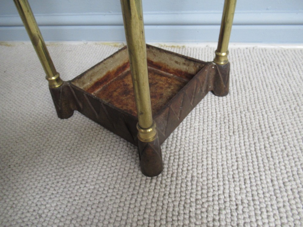 A    brass and cast iron       1900s walking stick stand. View V