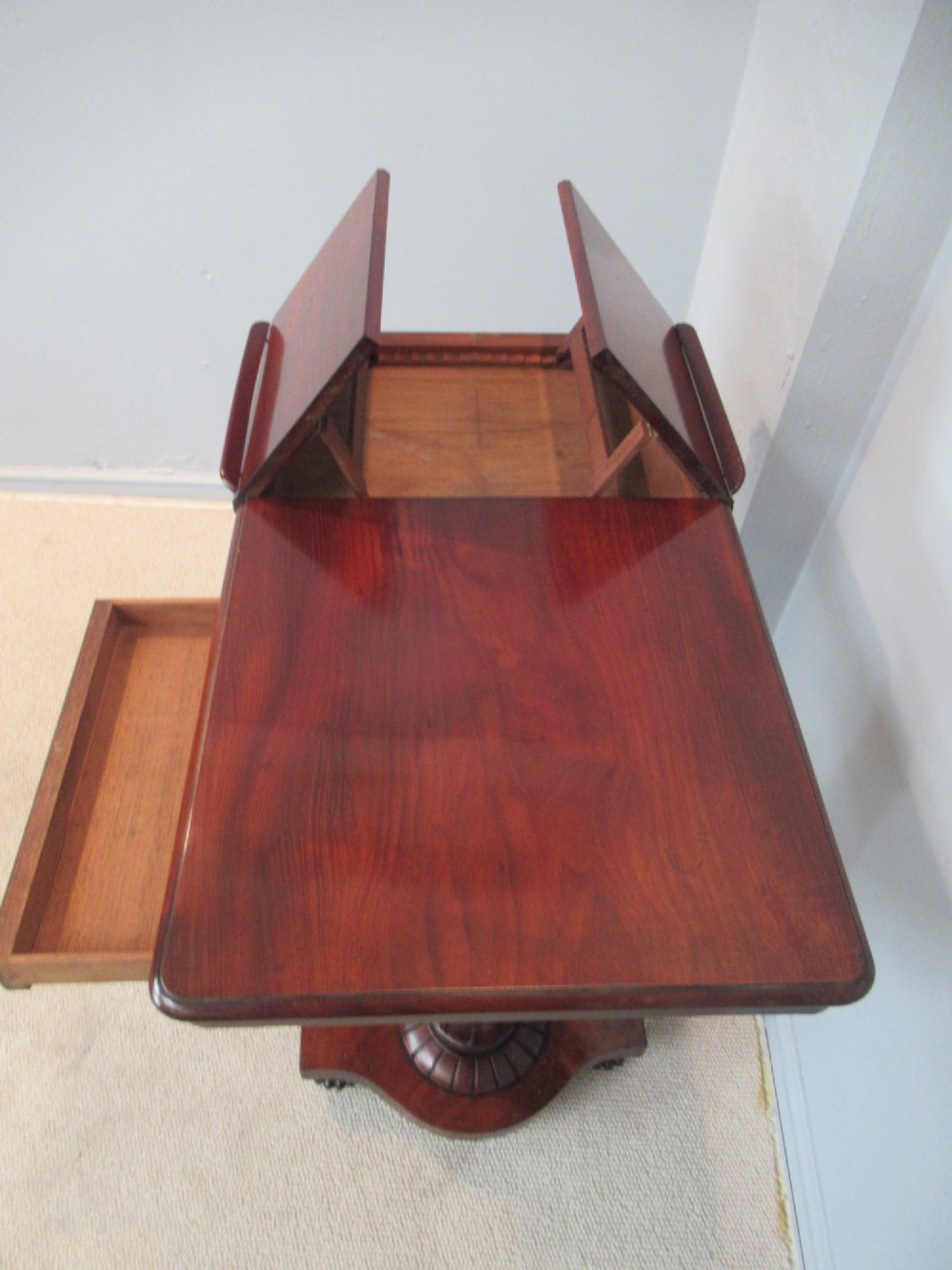 A 19th-century mahogany adjustable reading table featuring dual hinged ratcheted slopes on a turned pedestal base with an open side drawer. View II