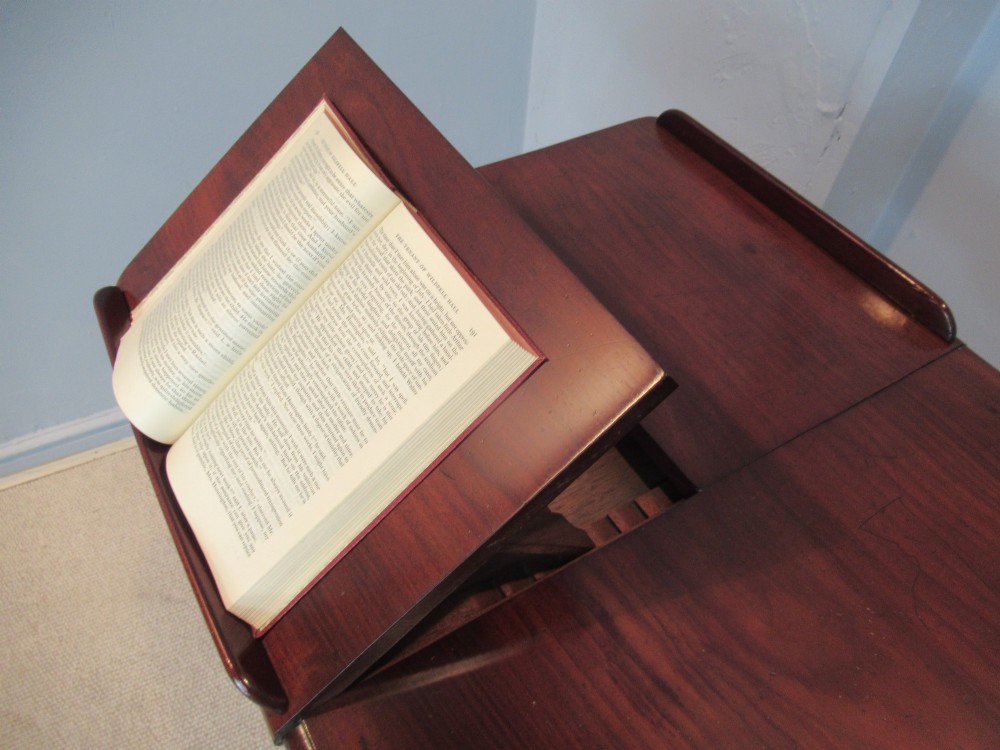A 19th-century mahogany adjustable reading table featuring dual hinged ratcheted slopes on a turned pedestal base with an open side drawer. View III