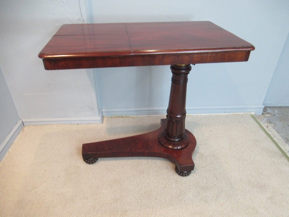 A 19th-century mahogany adjustable reading table featuring dual hinged ratcheted slopes on a turned pedestal base with an open side drawer. View V