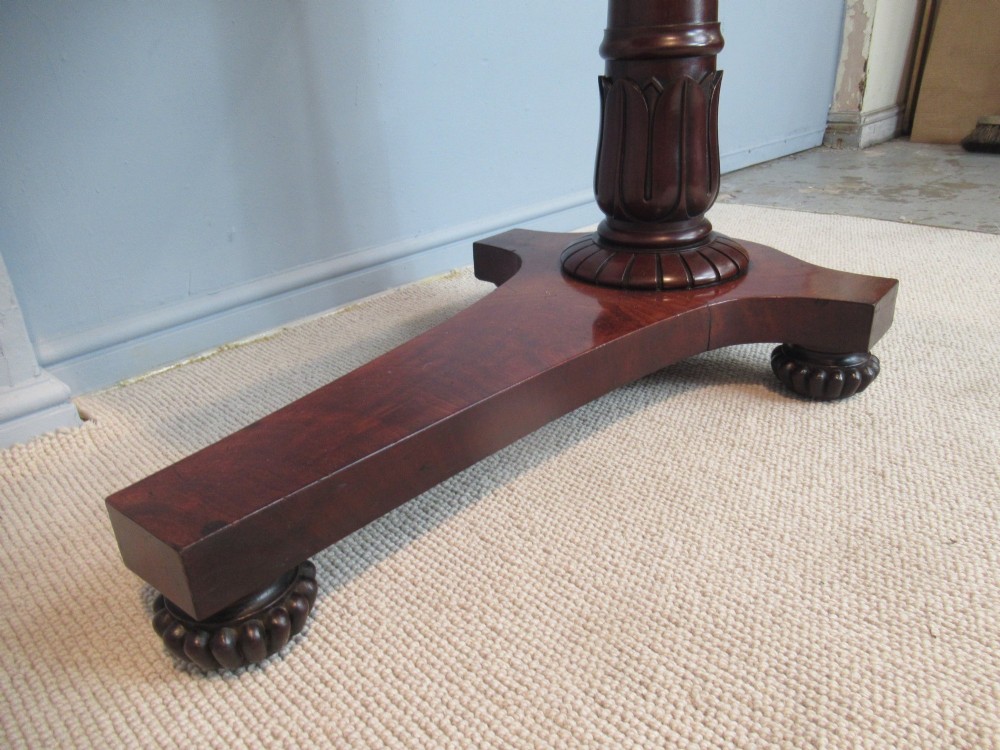 A 19th-century mahogany adjustable reading table featuring dual hinged ratcheted slopes on a turned pedestal base with an open side drawer. View VIII