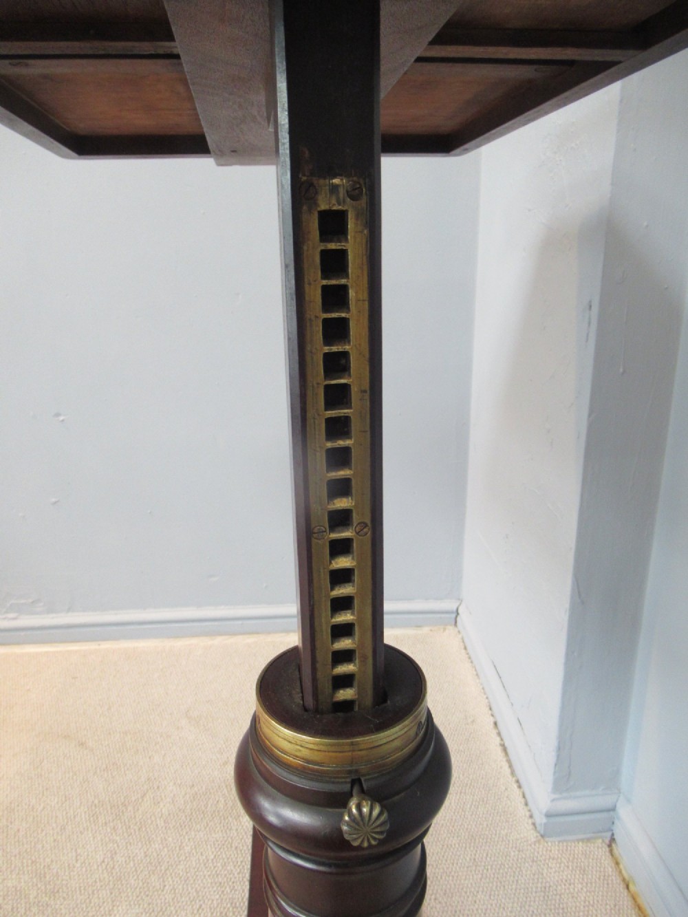 A 19th-century mahogany adjustable reading table featuring dual hinged ratcheted slopes on a turned pedestal base with an open side drawer. View X