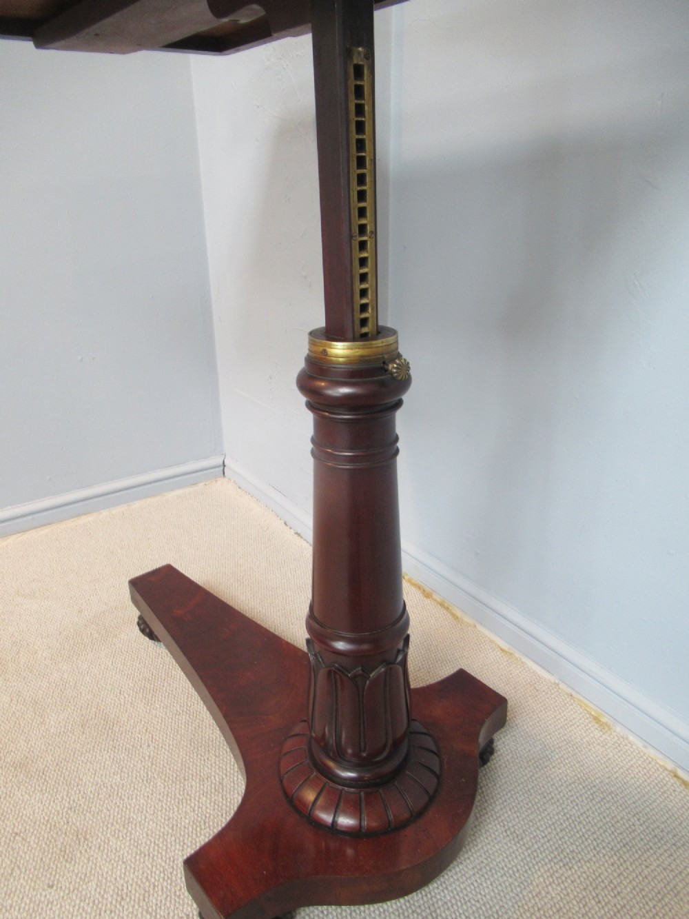 A 19th-century mahogany adjustable reading table featuring dual hinged ratcheted slopes on a turned pedestal base with an open side drawer. View XI