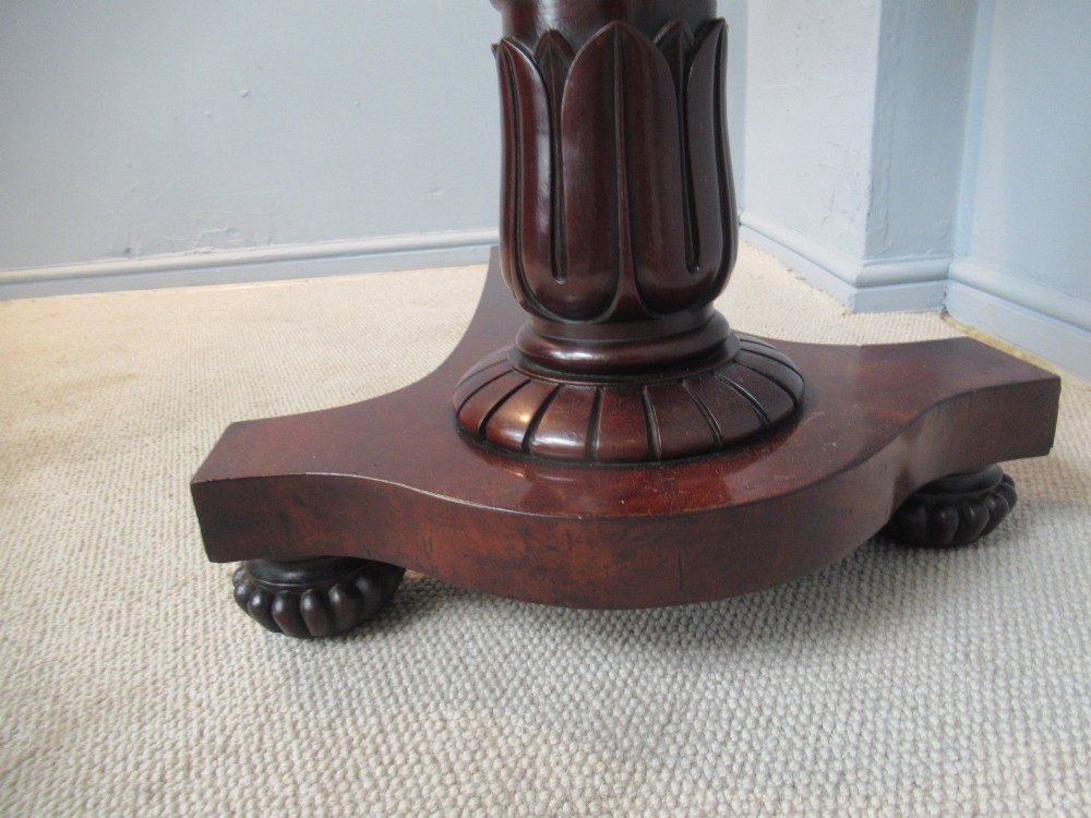 A 19th-century mahogany adjustable reading table featuring dual hinged ratcheted slopes on a turned pedestal base with an open side drawer. View XII