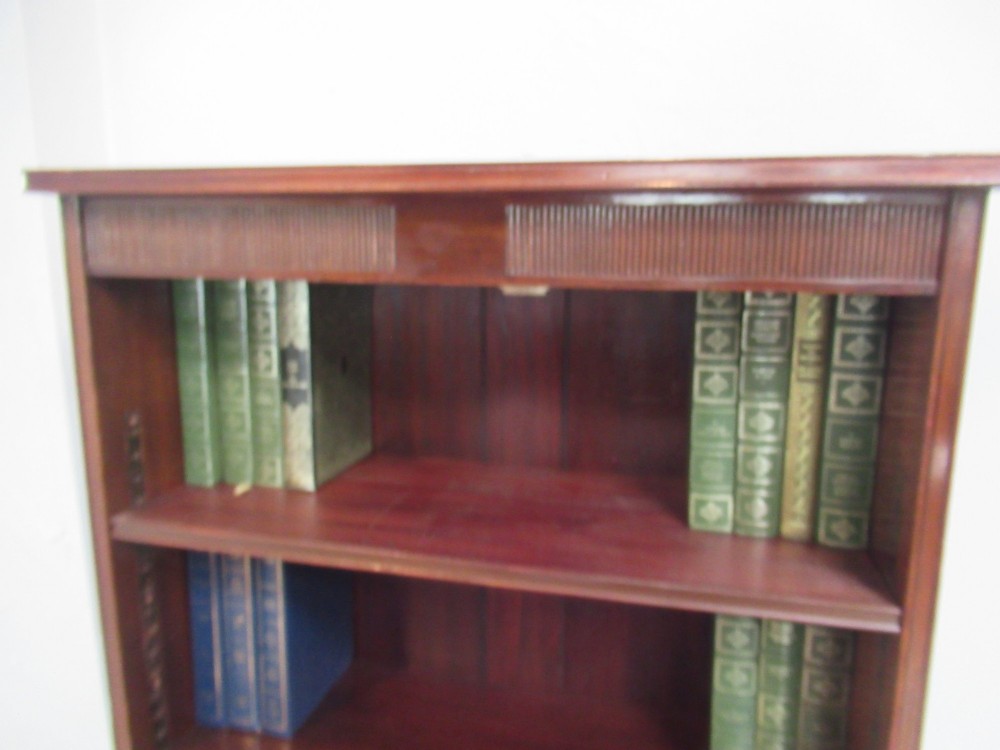 An antique dark mahogany open bookcase featuring four adjustable shelves, fluted frieze detailing at the top, and bracket feet. View VI