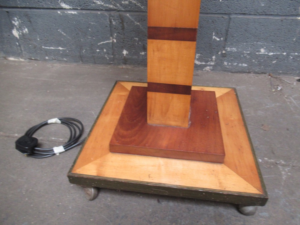 An Art Deco floor lamp crafted from geometric timber marquetry, featuring a central square tray table, a tall square column, and a stepped brass-rimmed base. View II