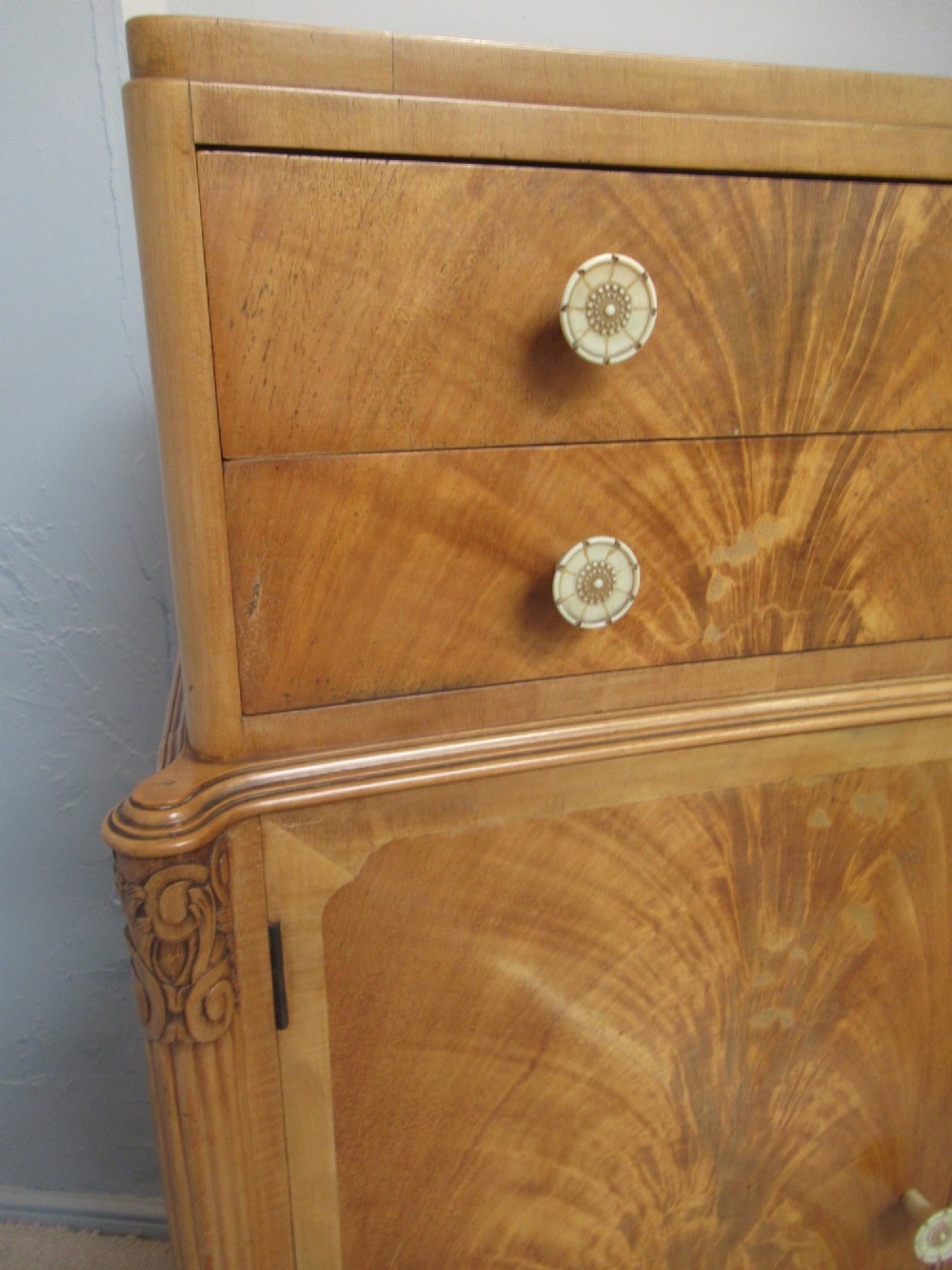 A mid-century fitted tallboy cabinet in pale mahogany and maple featuring two top drawers above double doors opening to reveal internal sliding shirt trays. View XI