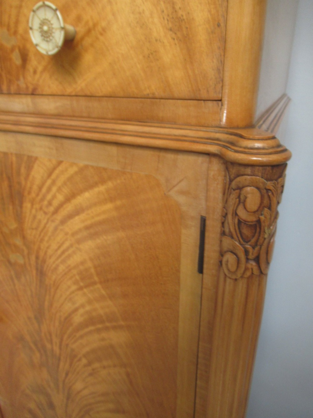 A mid-century fitted tallboy cabinet in pale mahogany and maple featuring two top drawers above double doors opening to reveal internal sliding shirt trays. View XII