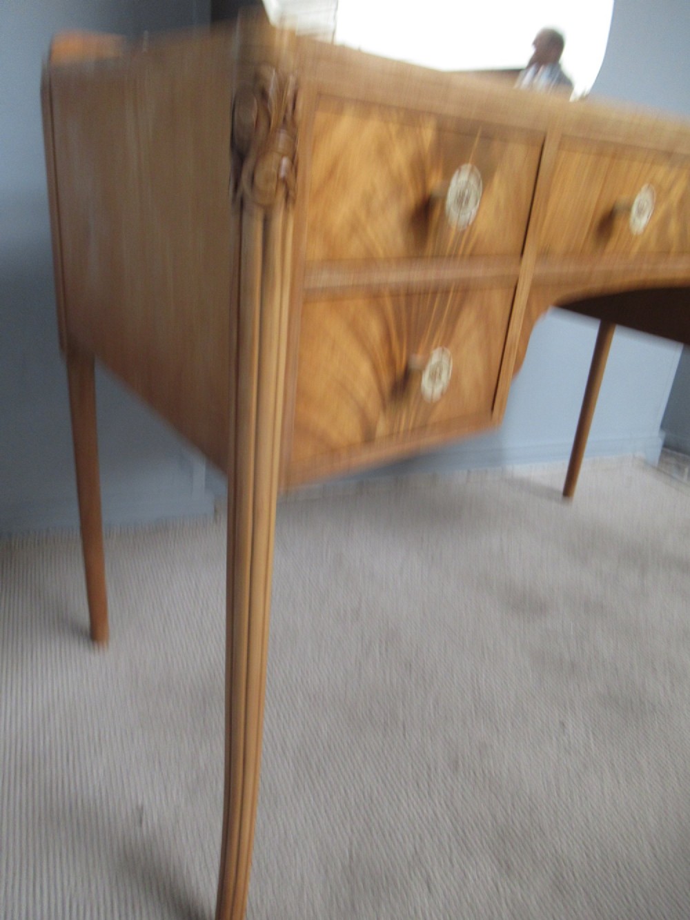 A 1930s Art Deco dressing table made from pale mahogany and maple, featuring an attached arched mirror, five drawers, and slender carved legs. View III