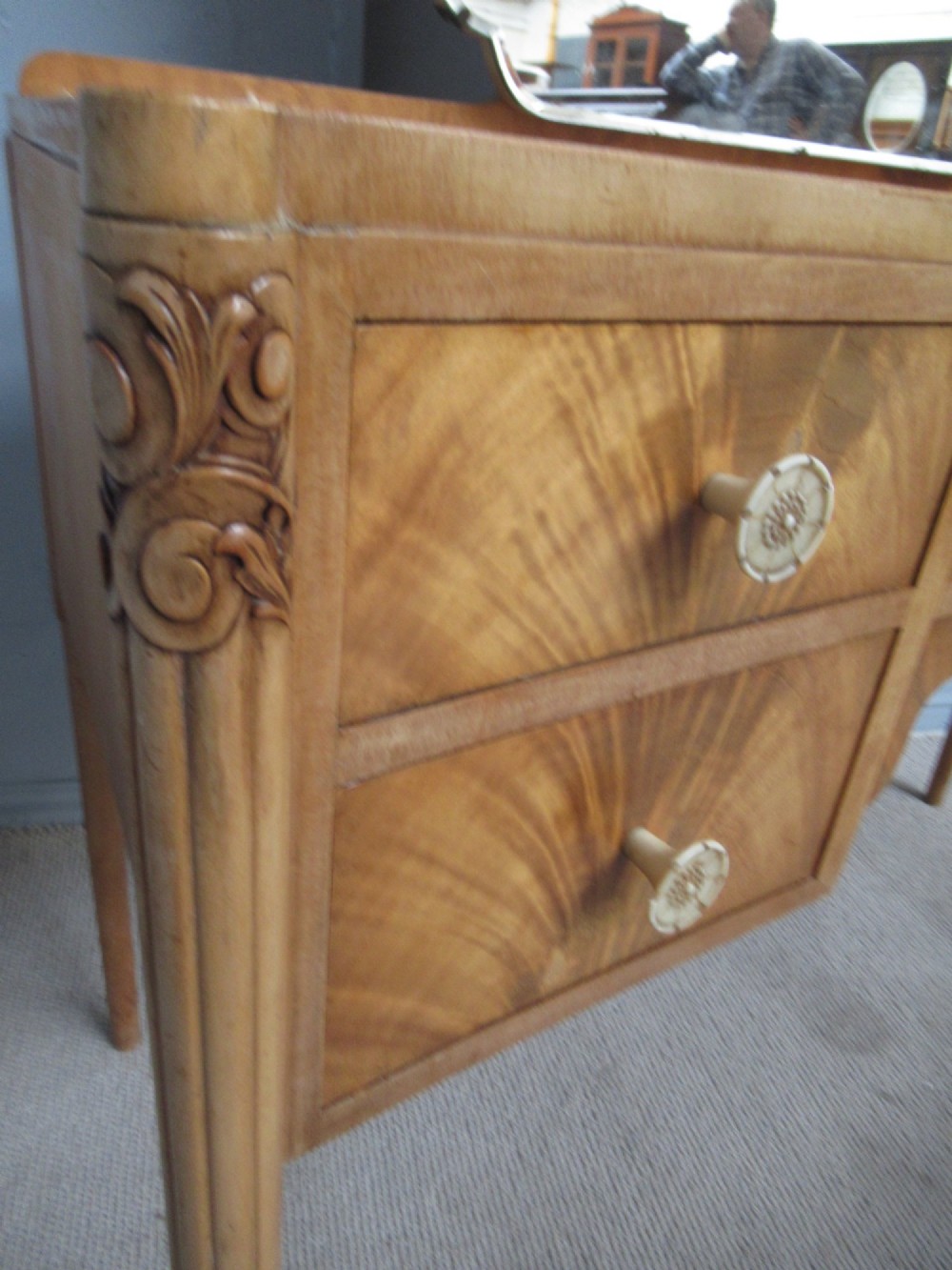 A 1930s Art Deco dressing table made from pale mahogany and maple, featuring an attached arched mirror, five drawers, and slender carved legs. View IV