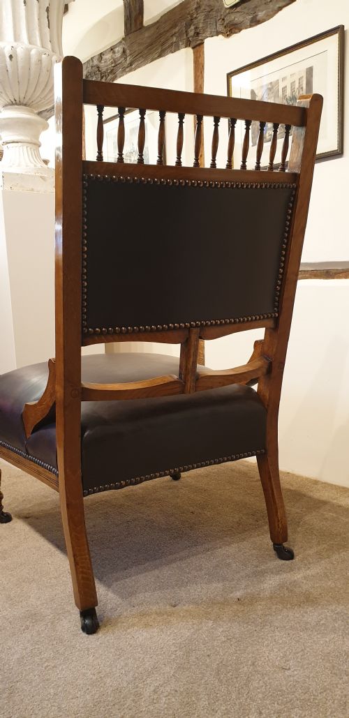 A BUTTON BACKED LEATHER UPHOLSTERED OAK AESTHETIC MOVEMENT ARMCHAIR WITH A MATCHING SLIPPER CHAIR - ADDITIONAL PHOTO 6