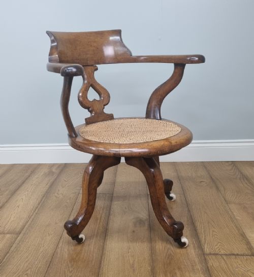an oak swivel desk chair with heart shaped back - CATEGORY: ANTIQUE CHAIRS - DATED 1880