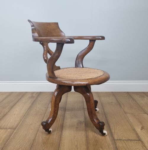 AN OAK SWIVEL DESK CHAIR WITH HEART SHAPED BACK - ADDITIONAL PHOTO 3
