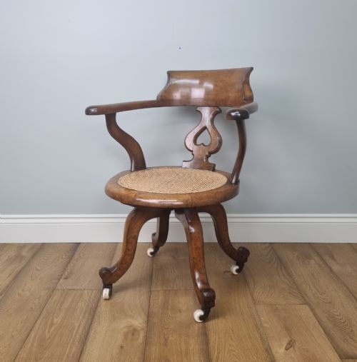 AN OAK SWIVEL DESK CHAIR WITH HEART SHAPED BACK - ADDITIONAL PHOTO 5