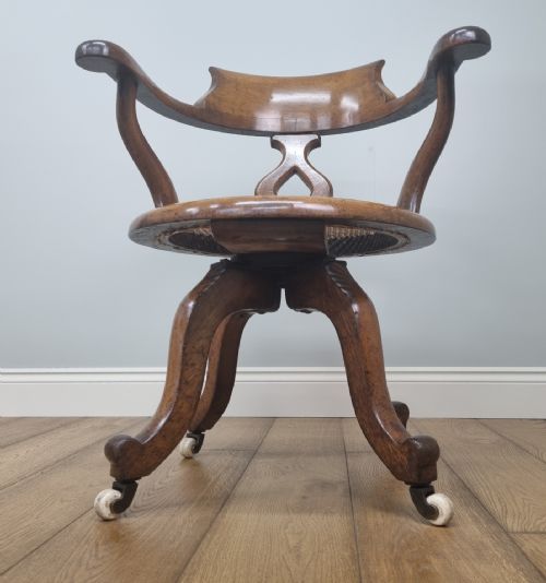 AN OAK SWIVEL DESK CHAIR WITH HEART SHAPED BACK - ADDITIONAL PHOTO 6