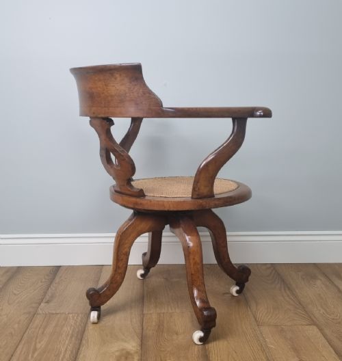 AN OAK SWIVEL DESK CHAIR WITH HEART SHAPED BACK - ADDITIONAL PHOTO 8