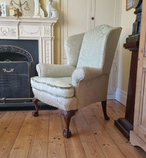 a fine quality 1920's claw ball wing armchair for reupholstery - CATEGORY: ANTIQUE CHAIRS - DATED 1920