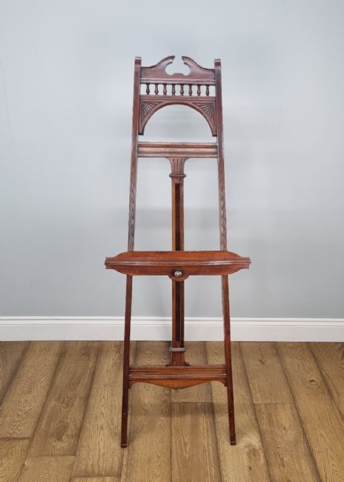 AN ANTIQUE WALNUT DISPLAY EASEL IN THE MANNER OF JAMES SHOOLBRED CO - ADDITIONAL PHOTO 1