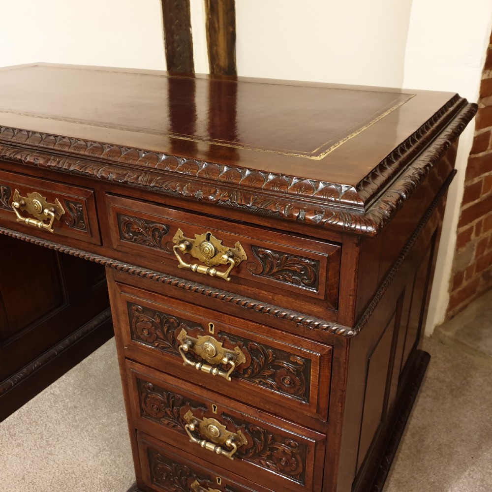 A finely carved & panelled mahogany pedestal desk  View V