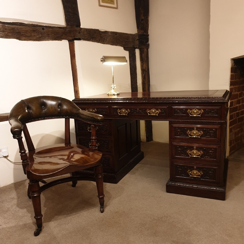 A finely carved & panelled mahogany pedestal desk  View IX