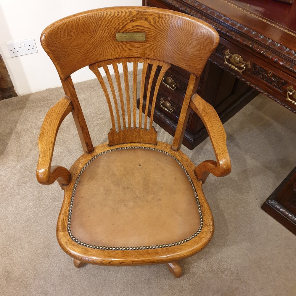 Light oak & leather seated revolving desk chair - presented to W Deedes by the past & present boys in 1912 View IV